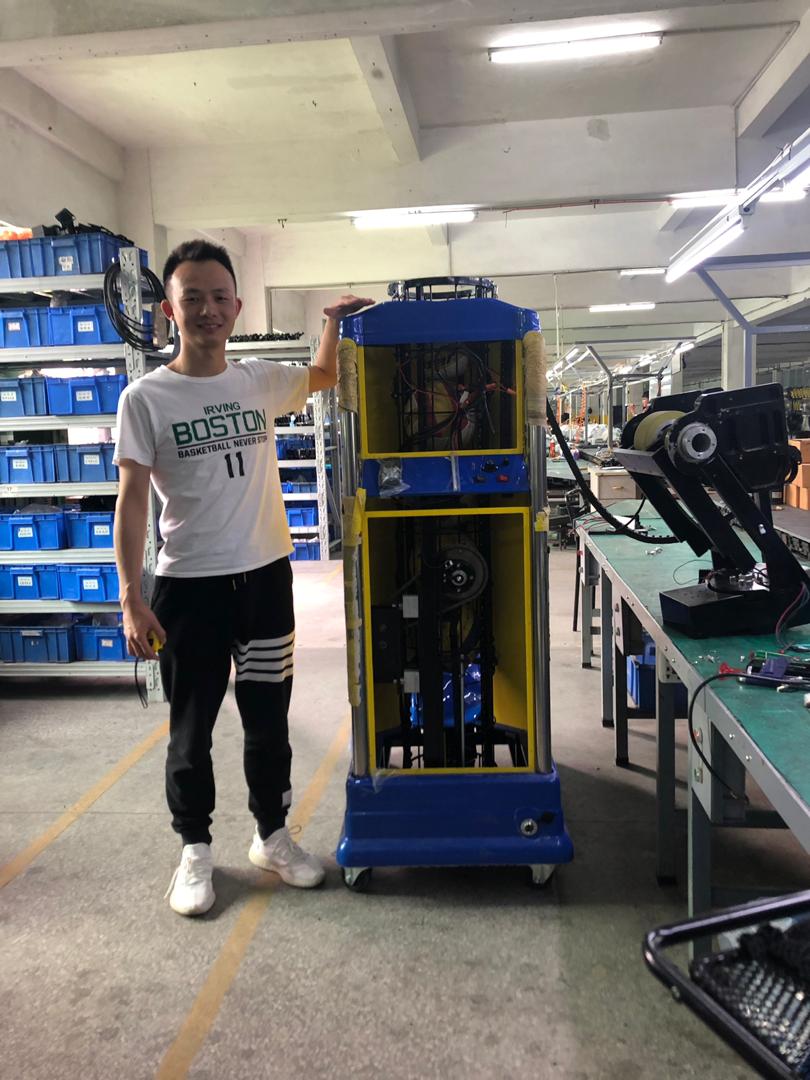 William Liu testing VEKEDA V2201A volleyball machine at factory