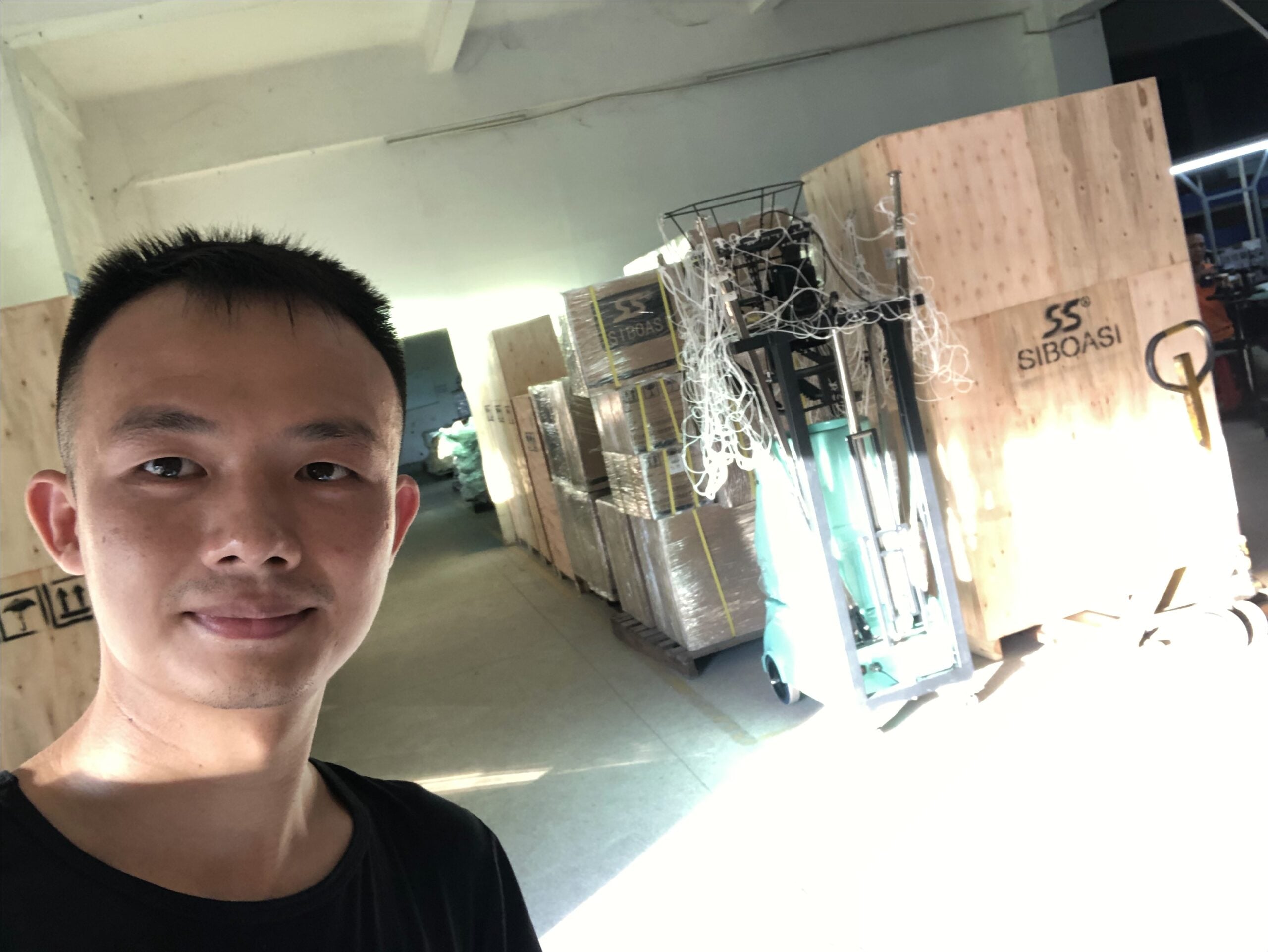 William Liu conducting a live factory tour for squash machine verification