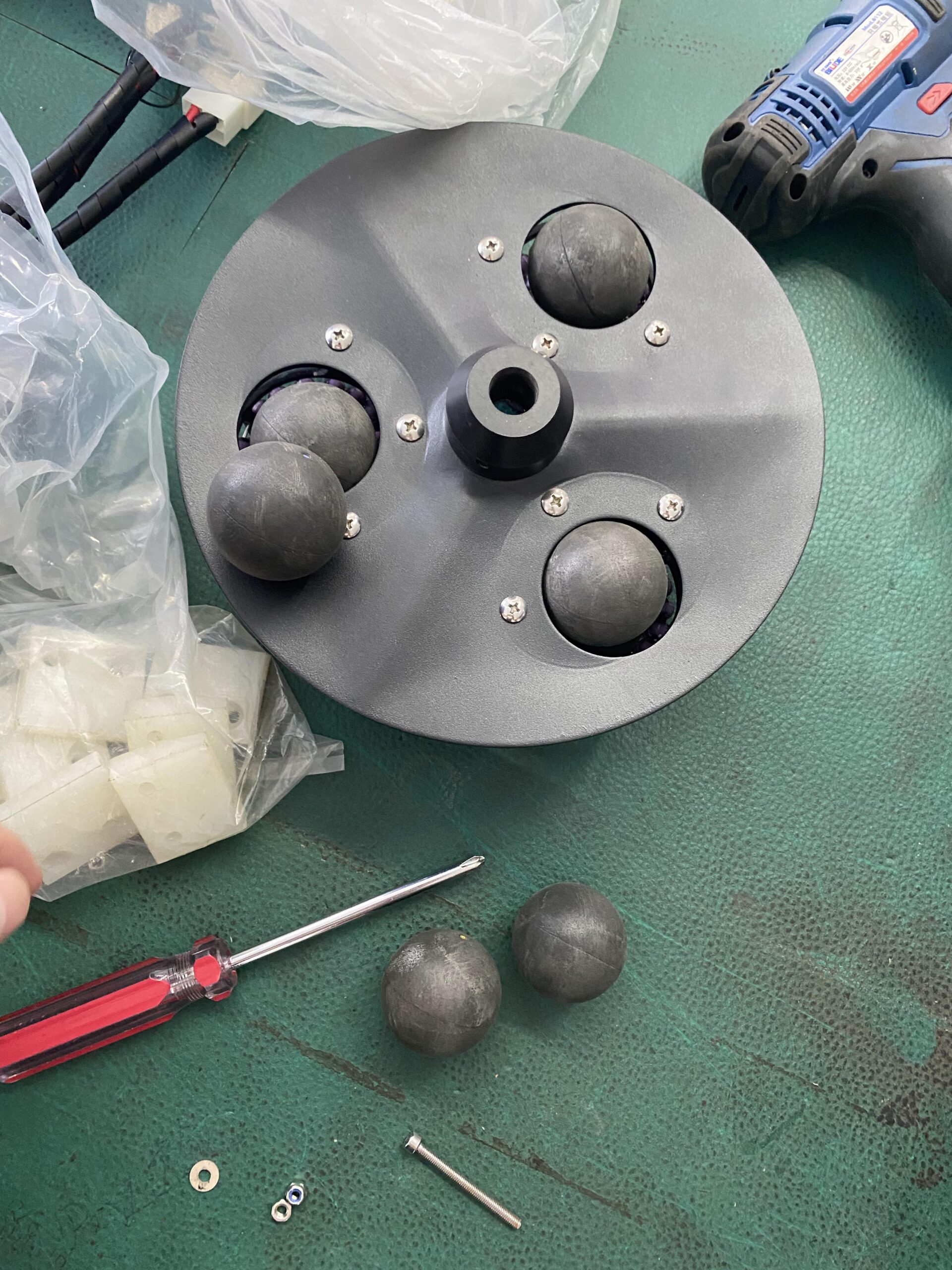 squash ball machine maintenance guide for VEKEDA S336A showing shooting wheels and ball hopper cleaning